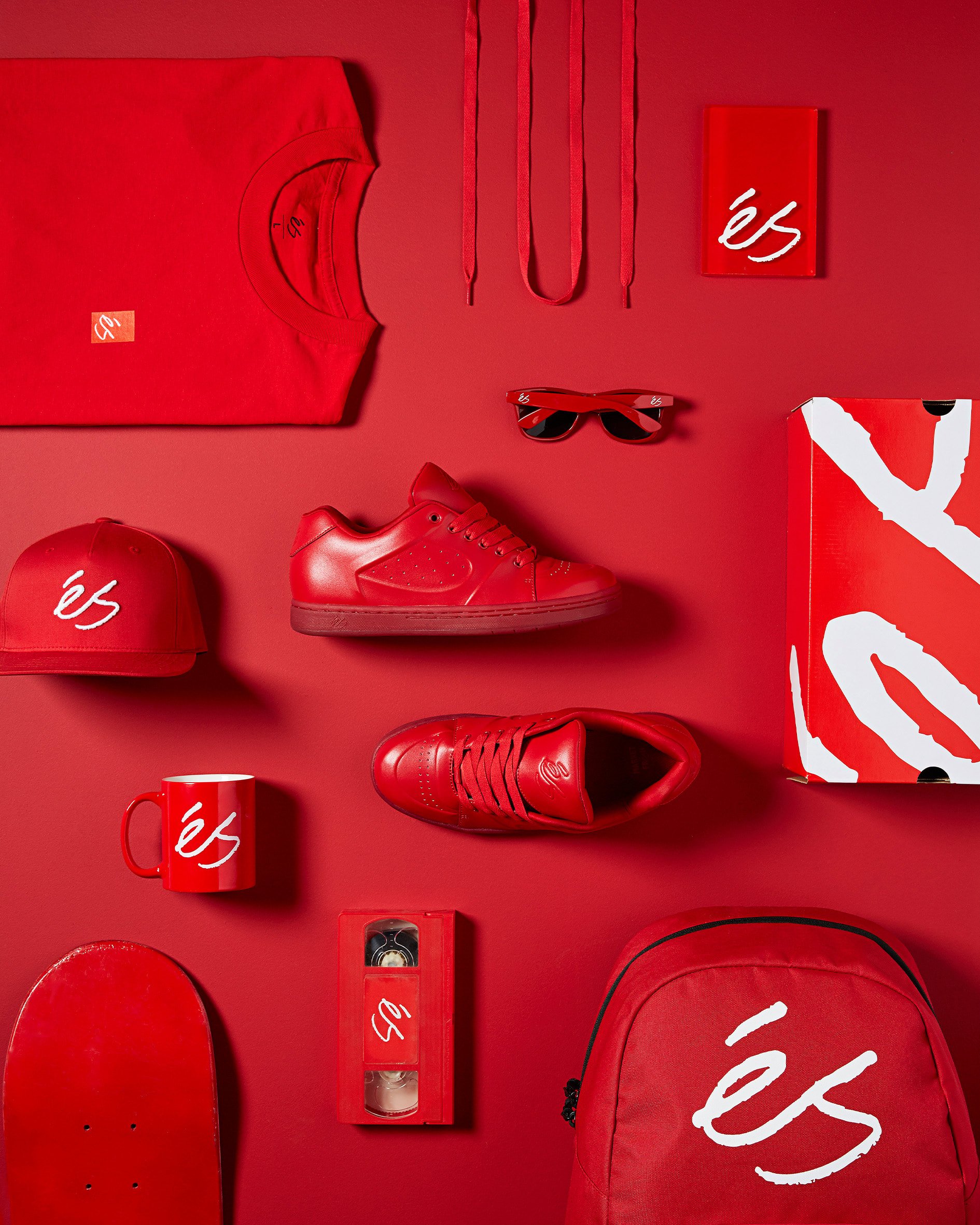 éS Footwear brand art direction — red product flat lay